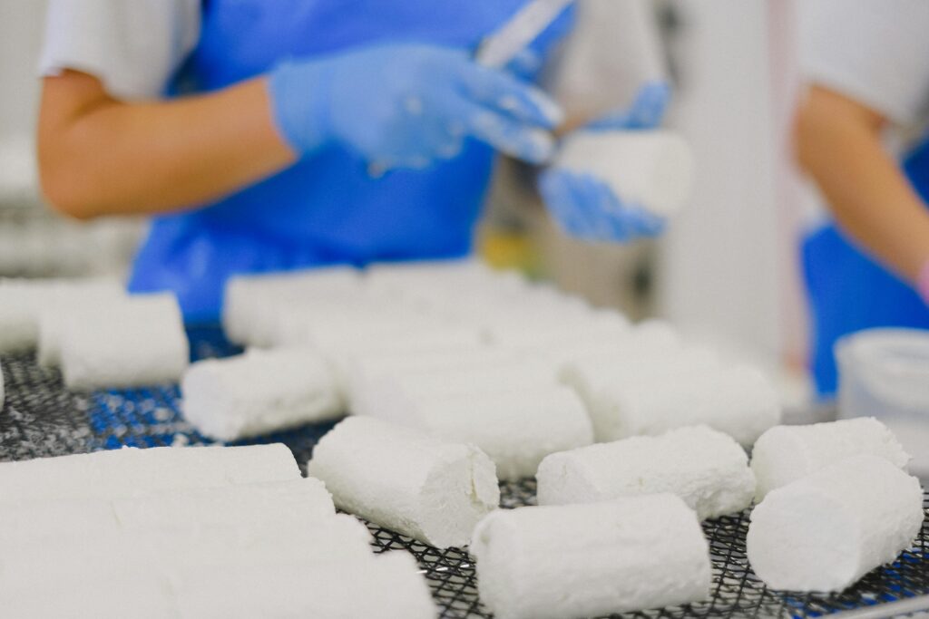 white goat cheese in a factory